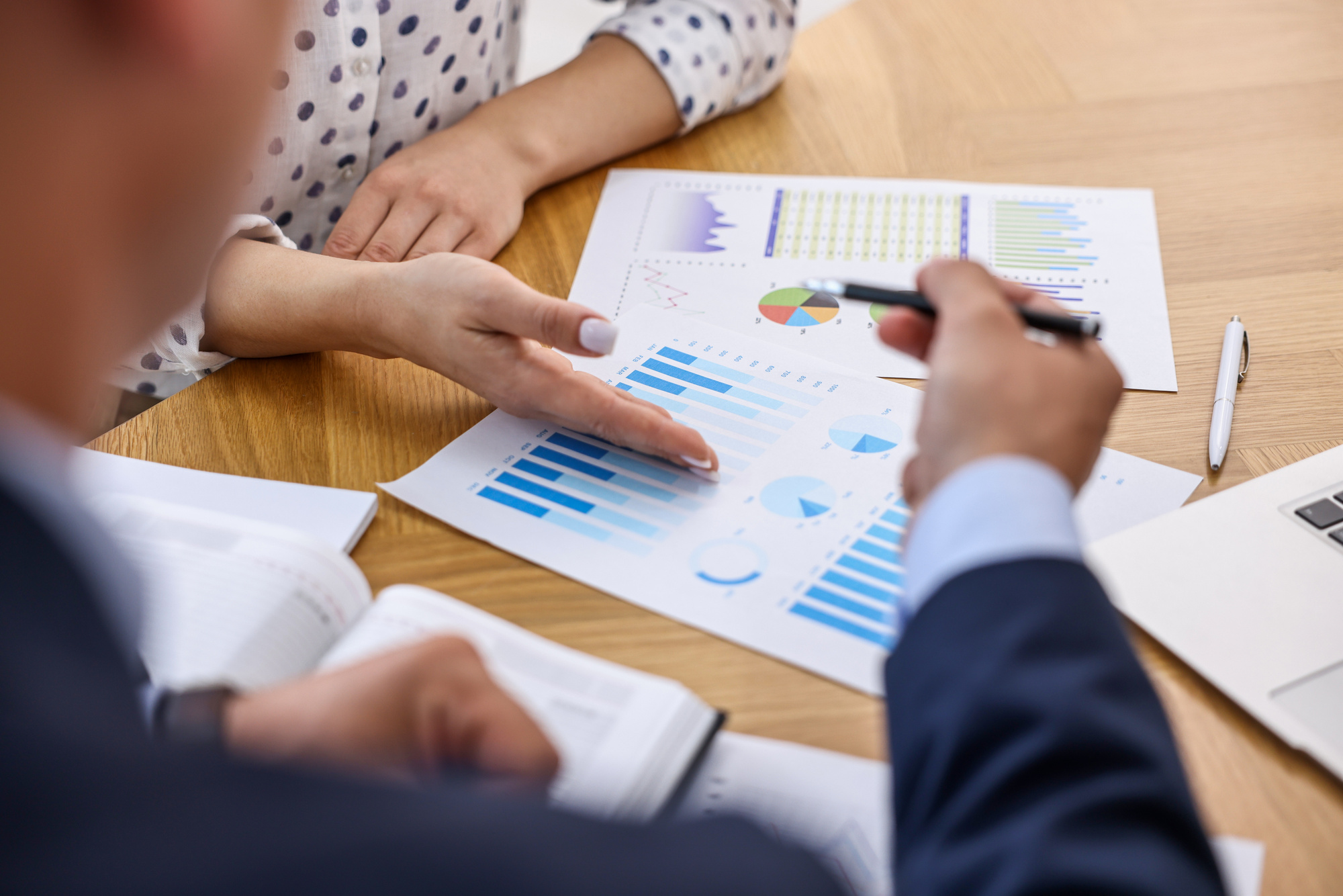 Financial professionals looking at data